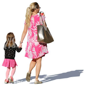 mother and daughter in summer dresses walking hand in hand