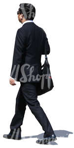 asian businessman in a black suit walking