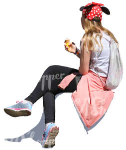 girl sitting and eating ice cream