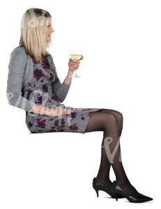 woman sitting in a cafe and drinking white wine