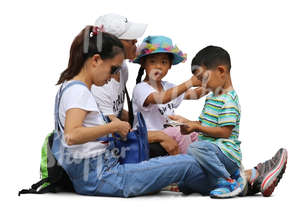 asian family of four sitting together