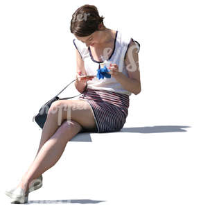 woman sitting and eating ice cream