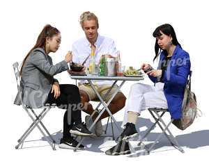 three people sitting in a cafe and eating