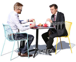two businessmen having a lunch in a cafe