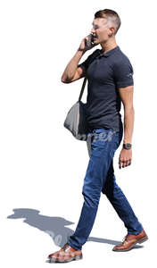 man walking and talking on a phone