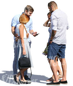 group of two couples standing and talking