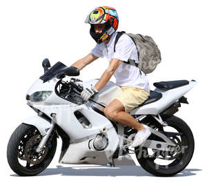 man in shorts riding a motorcycle
