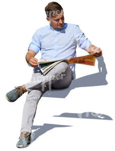 man sitting and reading a newspaper