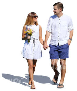 smiling couple walking hand in hand