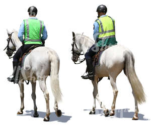 two mounted police officers riding