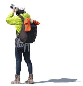 asian woman with a backpack taking a picture