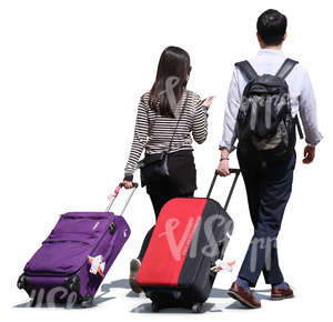 asian man and woman pulling large suitcases