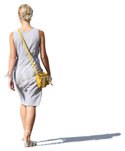 woman in a grey summer dress walking