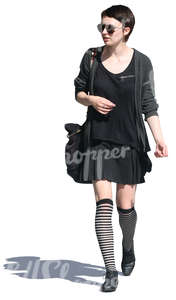 cut out woman in a black outfit walking
