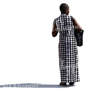 african woman in a long monochrome dress stanting