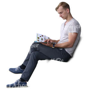 man sitting and reading a magazine