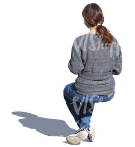 woman in a grey sweater sitting