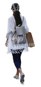 woman with a shopping bag walking