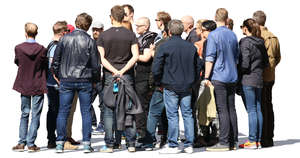 large group of people standing and talking