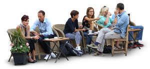 group of people sitting in a street cafe