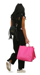 woman with pink shopping bags walking