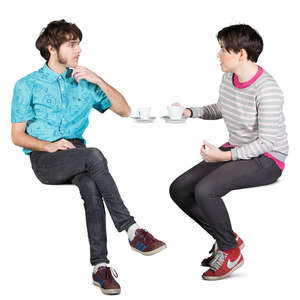 young man and woman sitting in a cafe