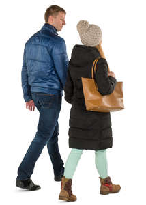 man and woman in winter coats walking