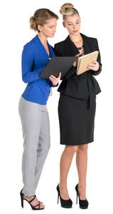 two female office workers looking at their notes