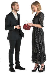 man and woman in formal wear standing and talking