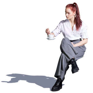 young woman sitting in a street cafe