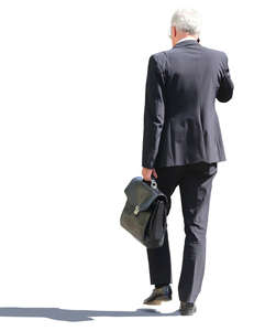 businessman in a dark suit walking