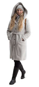 woman in a light grey hooded coat walking
