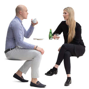 couple sitting in a cafe sitting and talking