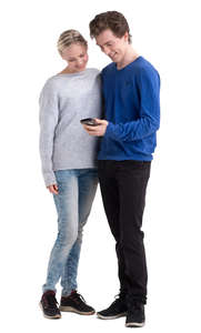 young man and woman standing and looking at a phone