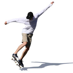 teenage boy doing a stunt on a skateboard