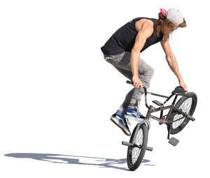 young man performing a stunt with his bmx
