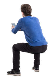 man sitting behind a desk