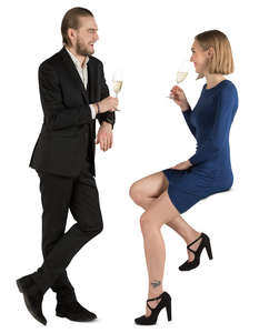 man and woman drinking champagne at a bar counter