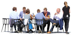 group of guests and a waitress in a street cafe