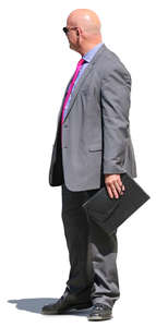 businessman with a pink tie standing