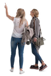 two women standing and pointing at smth