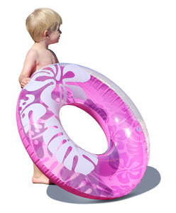 little boy with a swim ring standing in sunlight