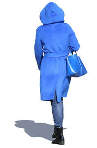 woman in a blue hooded coat walking