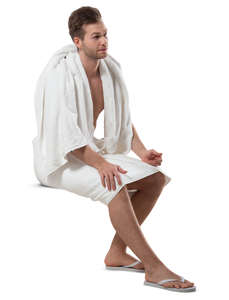 man in a spa towel sitting