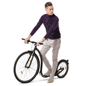 young man riding a kickbike