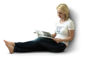 woman sitting and reading a magazine