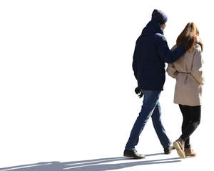 backlit couple walking