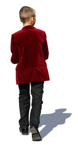 little boy in a formal velvet jacket walking
