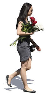 young asian woman with a flower bouquet walking