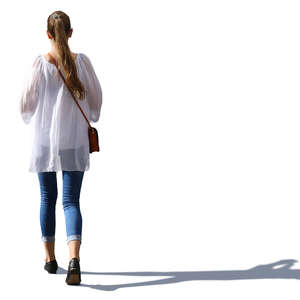 sidelit woman in a white blouse walking 